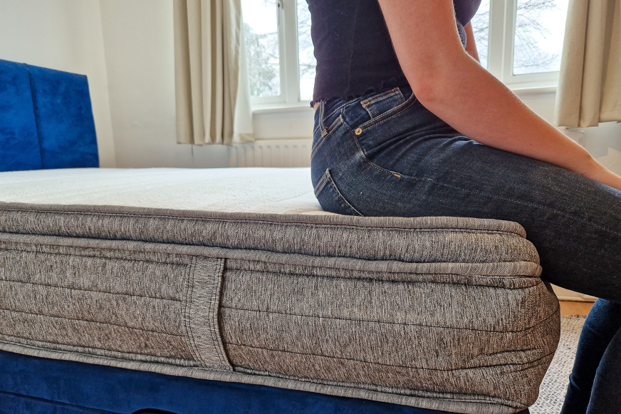 sitting on edge of origin mattress